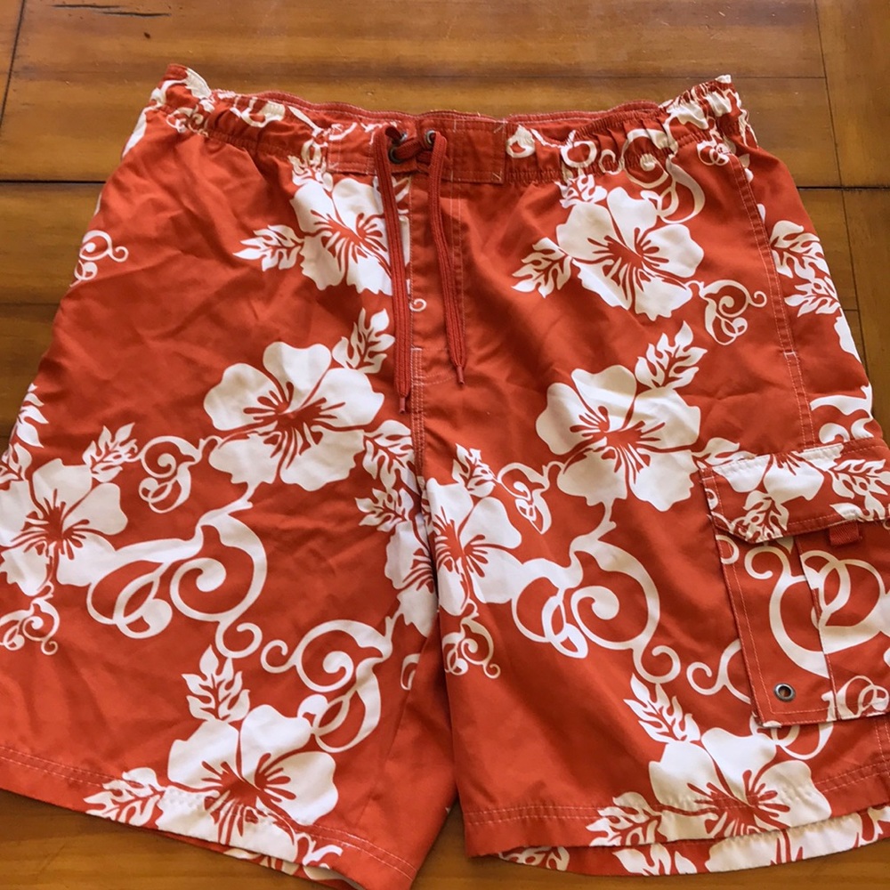 Swim trunks with orange hawaiian print